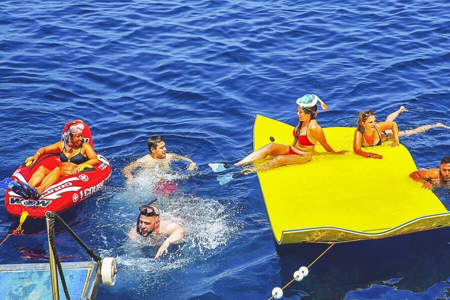 Ibiza: Beach Hopping Cruise w/ Paddleboard, Food, & Drinks - Music, Crew Energy, and the Feel of the Boat Party (Without Overdoing It)