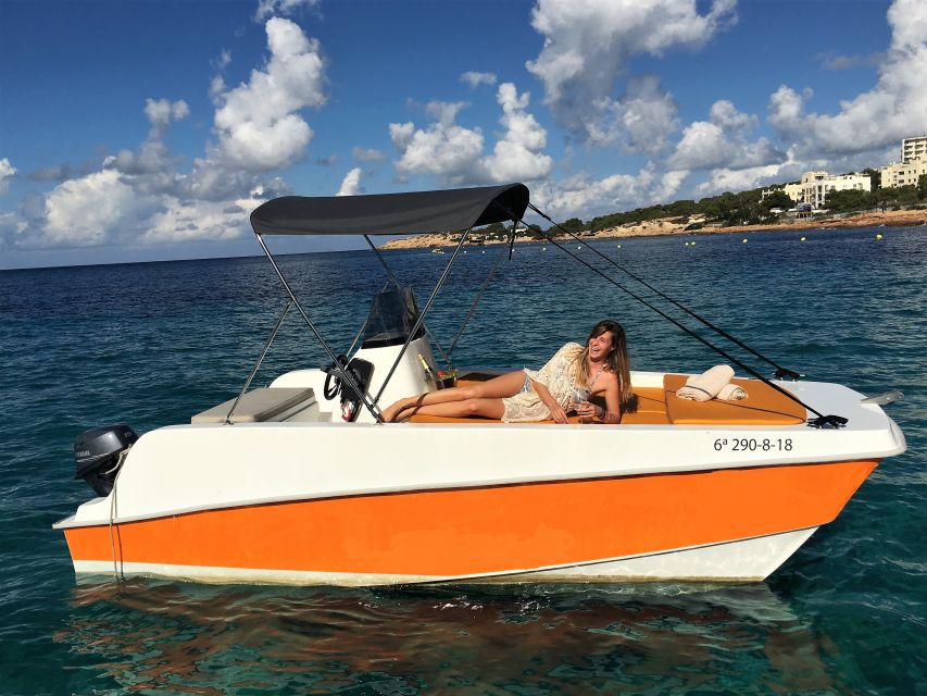 Ibiza: Discover the best coves in a boat driven by yourself - Entering Ibiza’s coastline from the helm: how the no-license catamaran works