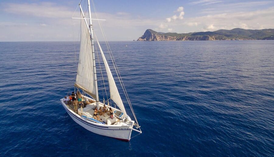 Ibiza: Private Sailboat with Premium Open Bar, Food & Music - Cala Bassa: the morning-to-lunch flow at a classic cove