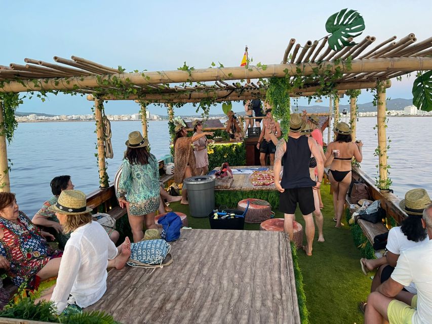 Ibiza: Sea Caves & Coves Snorkeling Paddle Boarding Tour - Amazonia boat details: jungle decor, wood bar, and real deck space