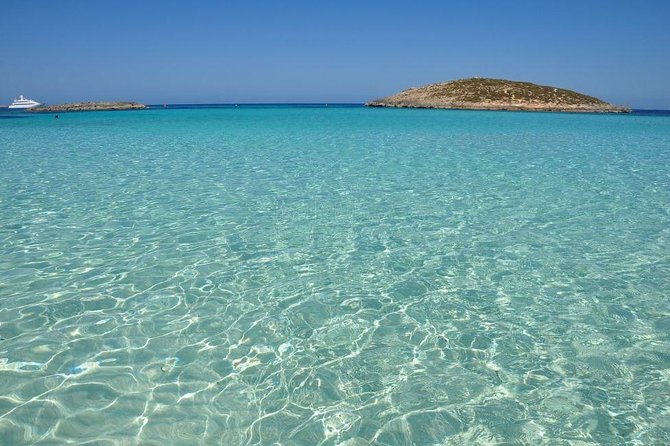 Ibiza Snorkeling Beach and Cave Tour - Platges de Comte: sandy-bottom snorkeling with a scenic feel
