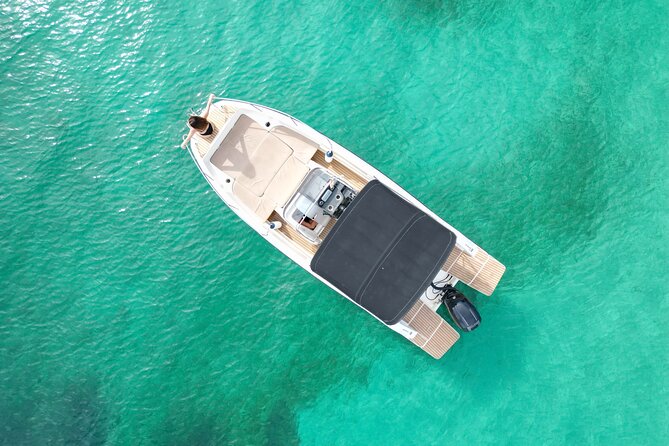 Private Boat Tour of San Antonio with Paddel surfing and Snorkeling - Stop 1 at Port des Torrent: first swim, first paddle surf, instant payoff