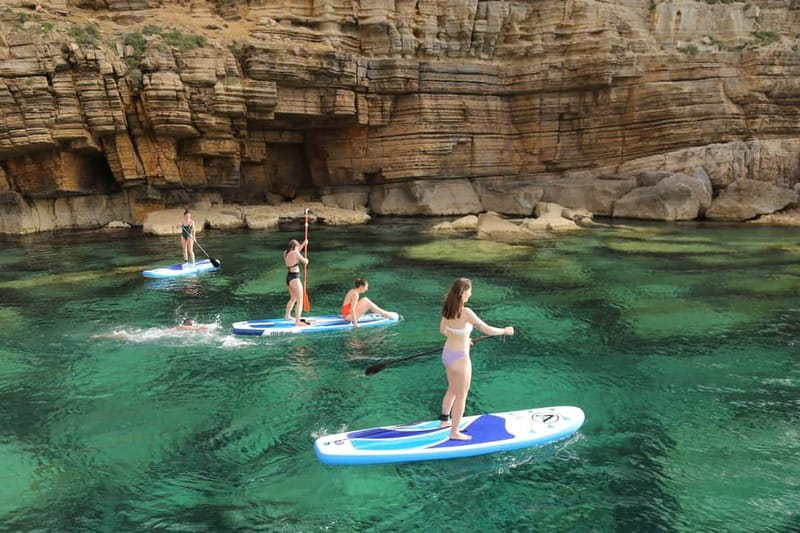 San Antonio: Cala Bassa, Cala Conta and Cave Boat Trip - Cala Bassa Stop: More Space to Play, Plus the Cliff-and-Cave View