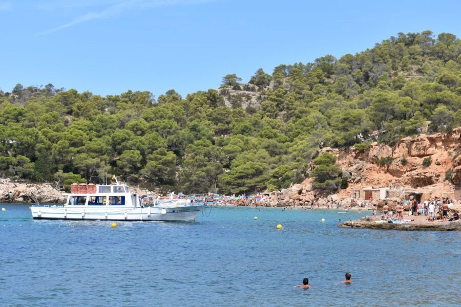 Sant Antoni: Round-Trip Ferry Transfer to Cala Salada Beach - Cala Salada: Pines, a Beach Bar, and Seafood on Hand